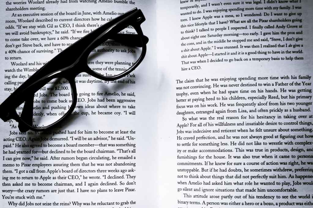 eyeglasses resting on an open book