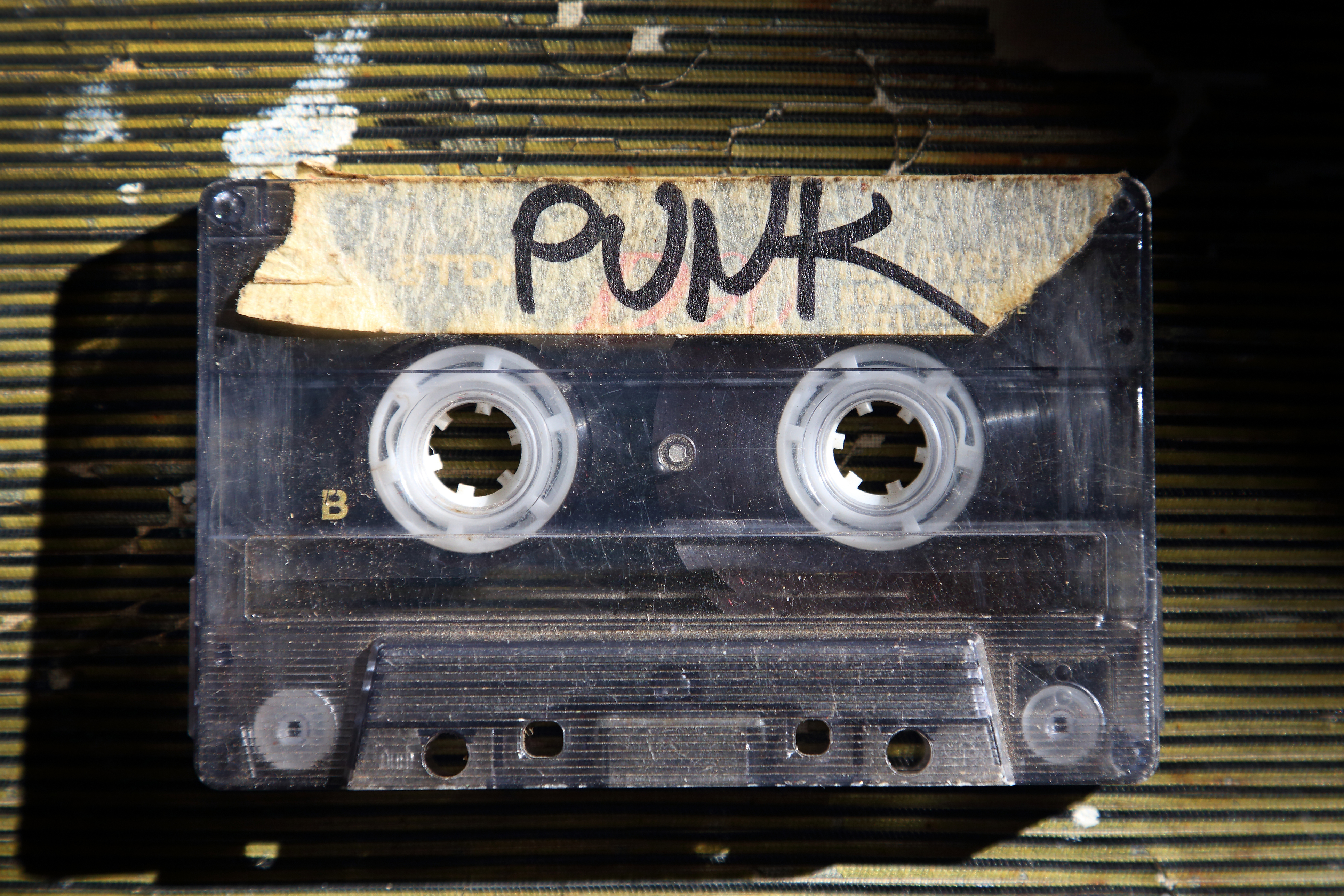 Audio cassette tape labeled PUNK with a black maker and masking tape