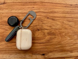 Sensory kit on a clip: @matadorequipment ear plug case with Mack's slim fit ear plugs, @apple AirPods Pro, and @loopearplugs concert ear plugs all dangling from a @jrwgear G-Flex clip