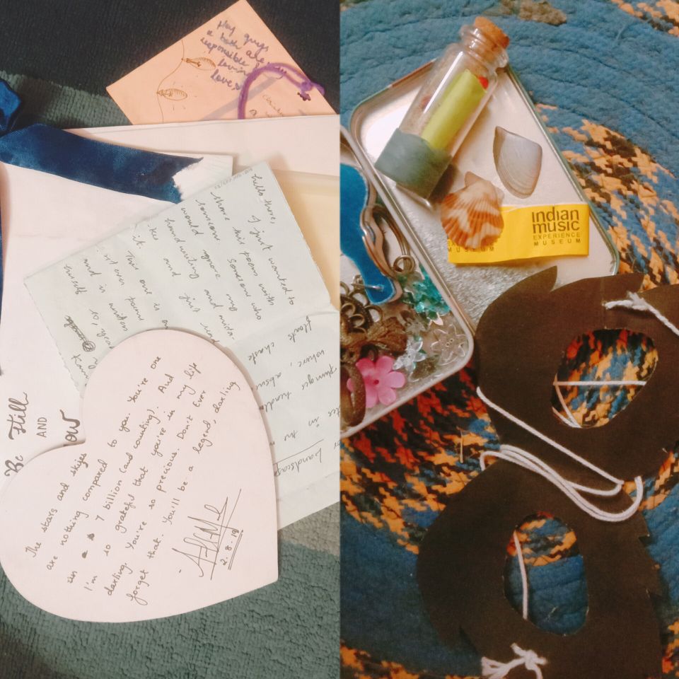 Left side:

Handwritten cards and notes laying in a loose pile on a table

Right side:

A tin box full of crafting supplies, cardboard cut into a shape with a piece of yarn attached