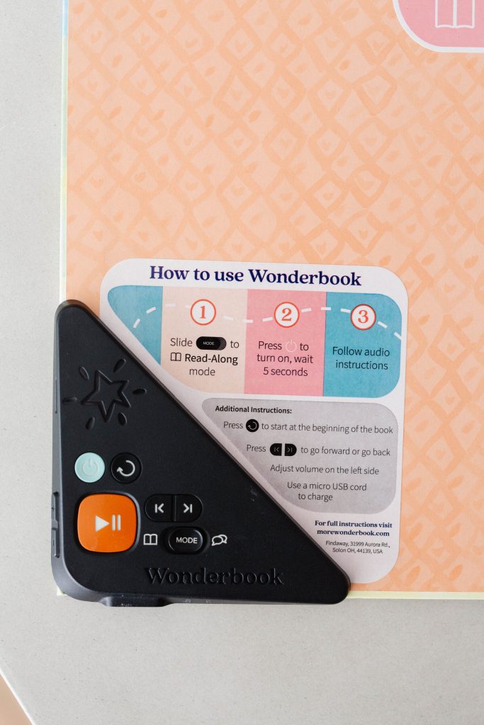 A book with audio controls in the corner