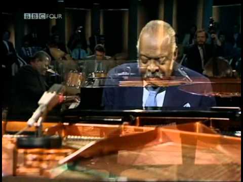 Count Basie at a grand piano