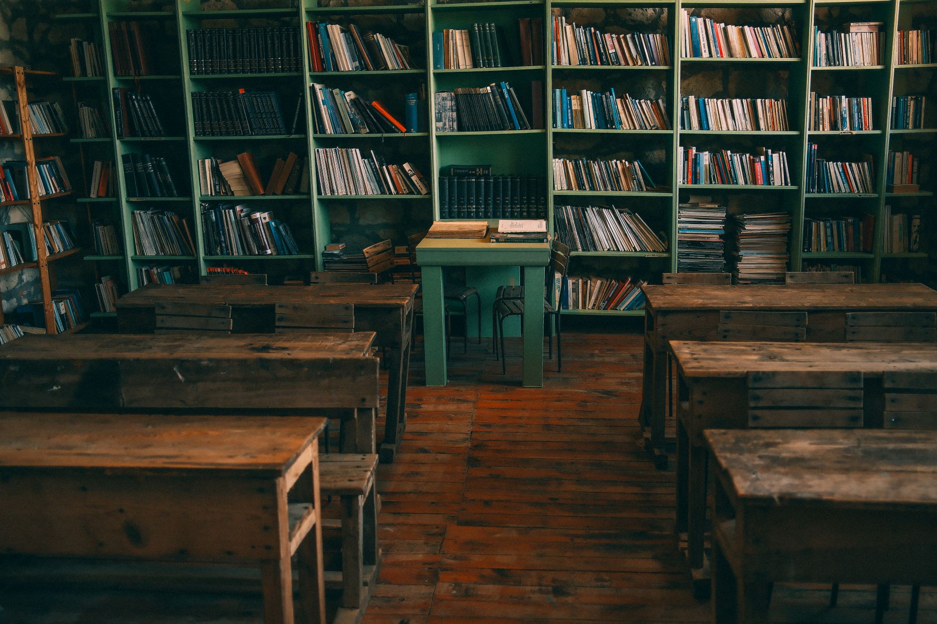 vintage classroom with wooden desks and bookshelves